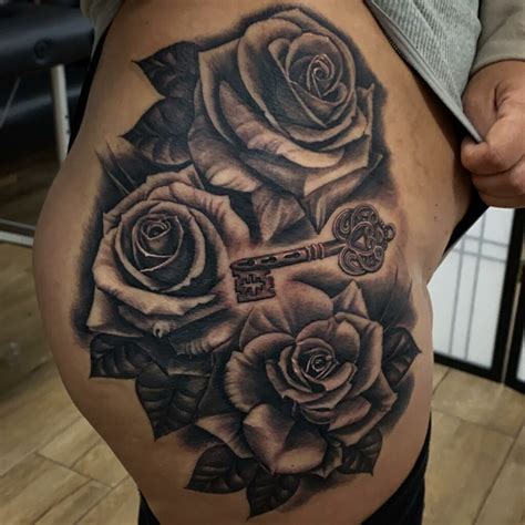 rose thigh tattoo